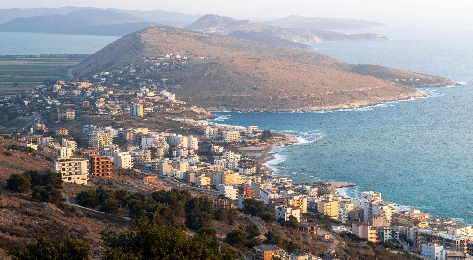 Saranda's coast in evening light, seen from the hill of Lëkurës